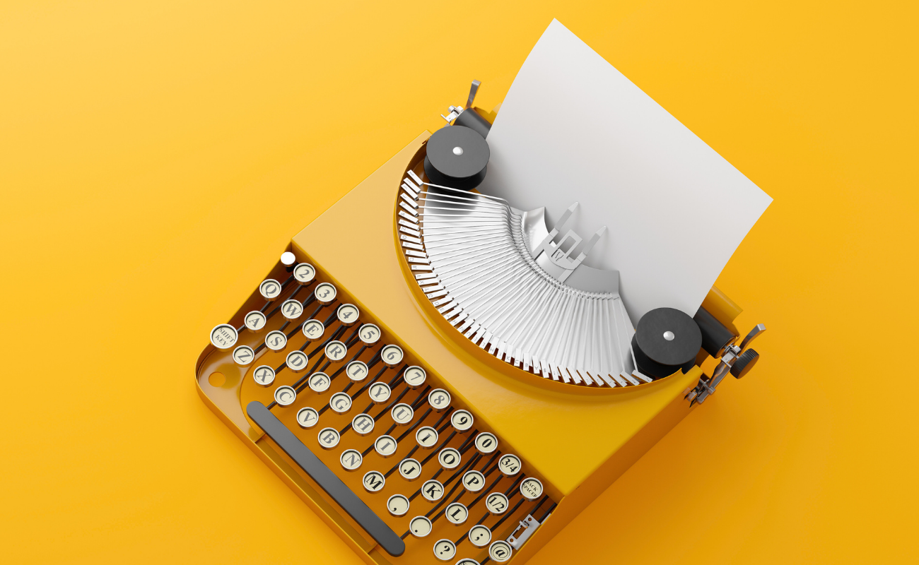 Yellow Retro Typewriter – Magtyne Marketing Creativity Visual Retro yellow typewriter on bright background